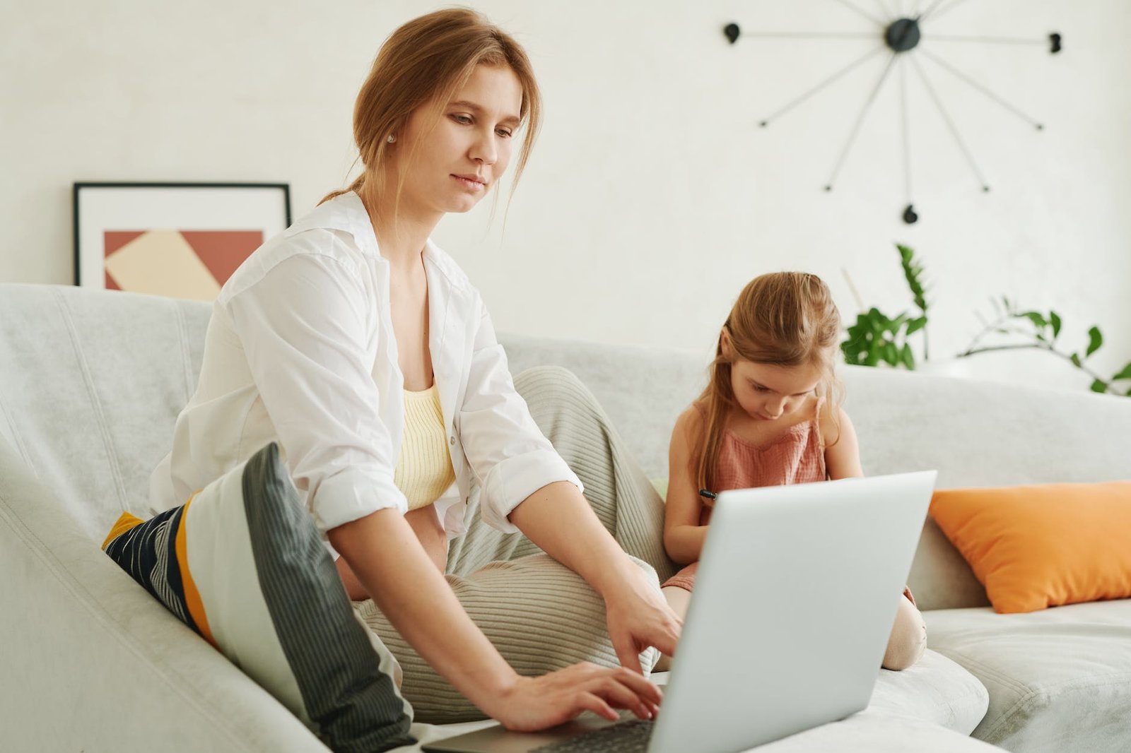 a woman working beside her daughter